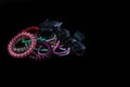 Hair accessories, colorful hair scrunchies isolated on black background