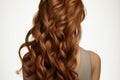 Hair artistry Long brown curly hair, white backdrop, artful touch of blond design