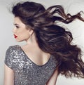 Hair. Beautiful model girl with healthy long wavy shiny hair iso Royalty Free Stock Photo