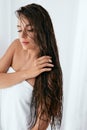 Hair And Body Care. Woman With Wet Long Hair Wrapped In Towel Royalty Free Stock Photo