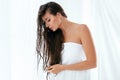 Hair And Body Care. Woman With Wet Long Hair Wrapped In Towel Royalty Free Stock Photo