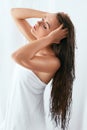 Hair And Body Care. Woman With Wet Long Hair Wrapped In Towel Royalty Free Stock Photo