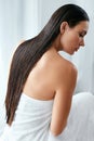 Hair And Body Care. Woman With Wet Long Hair Wrapped In Towel