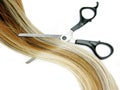 Hair brush and scissors in highlight hair Royalty Free Stock Photo