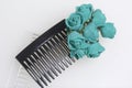 Hair care. Accessories and decorations. Two scallops for hair are transparent and black in color. Artificial rose flowers are emer