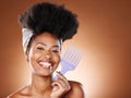 Hair care, beauty and black woman with afro comb for a routine in studio with mockup space. Happy, smile and portrait of
