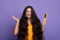 Smiling Young Indian Woman With Long Hair Holding Wooden Comb Royalty Free Stock Photo