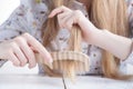 Hair Care. Closeup Of Beautiful Woman Hairbrushing Hair With Brush. Portrait Of Female Woman Brushing Long Straight Healthy Royalty Free Stock Photo