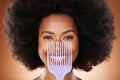 Hair care, comb and black woman with smile, natural beauty and skincare against brown studio background. Cosmetics Royalty Free Stock Photo