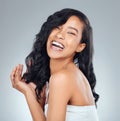 Hair care, laughing and portrait of a woman with beauty isolated on a grey background in studio. Happy, smile and a Royalty Free Stock Photo