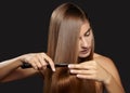 Hair care photo. Beautiful woman after Bath Hairbrushing Healthy Straight Brown Hair. Model Brushing Her Long Hair Royalty Free Stock Photo