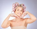 Hair care, rollers and portrait of woman in a studio doing a natural, beautiful and curly hairstyle. Self care, happy Royalty Free Stock Photo