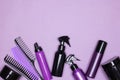 Hair care and styling products with combs on purple background. Copy space Royalty Free Stock Photo