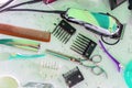 A Hair clipper and scissors with comb on white table. Royalty Free Stock Photo