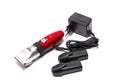 Hair clipper, two replaceable batteries, charger on white background Royalty Free Stock Photo