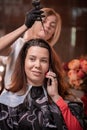 Hair coloring in the salon, hair styling. Professional wizard paints the hair in the salon. Beauty concept, hair care. Royalty Free Stock Photo