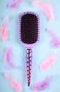 Hair comb on color background, fashion idea. Flat lay and overhead image