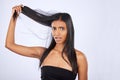 Hair damage, breakage and portrait of a frustrated woman isolated on a white background in studio. Bad, unhappy and an Royalty Free Stock Photo