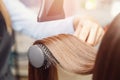 Hair dryer, concept cut salon, female stylist. Royalty Free Stock Photo