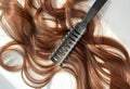 Hair extension dark, close-up on a white background Royalty Free Stock Photo