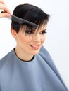 Hair. Hairdresser doing Hairstyle. Beauty Model Woman. Haircut. Royalty Free Stock Photo