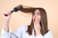 Hair loss woman with a comb and problem hair. Hairloss and hairs problems. Sad girl with damaged hair. Haircare and loss Royalty Free Stock Photo