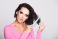 Hair loss woman with a comb and problem hair. Hairloss and hairs problems. Sad girl with damaged hair. Tangling hairs Royalty Free Stock Photo