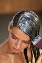 Hair Masks. Woman Applying Mask With Brush On Wet Long Hair Royalty Free Stock Photo