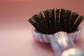 Hair massage comb brush with handle for all types  on pink pastel copy space background. Minimalistic style. Royalty Free Stock Photo