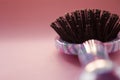 Hair massage comb brush with handle for all types  on pink pastel copy space background. Minimalistic style. Royalty Free Stock Photo