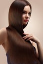 Hair. Portrait of Beautiful Woman with Long Brown Hair. High qua