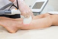 Hair removal on the legs, laser procedure at medical clinic Royalty Free Stock Photo