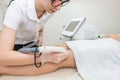 Hair removal on the legs, laser procedure at medical clinic Royalty Free Stock Photo