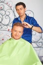 Hair salon. Men`s haircut. Cutting.