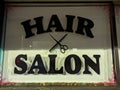 Hair salon sign with scissors and comb