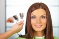 Hair salon. Woman choses color of dye.