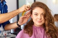 Hair salon. Woman haircut. Combing.