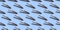 Hair straightener seamless pattern on blue background