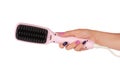Hair straighteners in hand Royalty Free Stock Photo