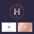 Hair studio logo. H and S in gold letters. H, S illusory monogram. Royalty Free Stock Photo