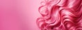 Hair style banner. Close up of pink woman\'s hair on pink background. Glossy wavy hair