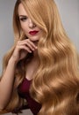 Hair Style. Beautiful Woman With Healthy Wavy Long Blonde Hair Royalty Free Stock Photo