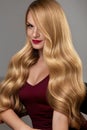 Hair Style. Beautiful Woman With Healthy Wavy Long Blonde Hair Royalty Free Stock Photo