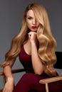 Hair Style. Beautiful Woman With Healthy Wavy Long Blonde Hair