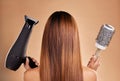 Hair, styling and brush with hairdryer and woman in studio for beauty, grooming and salon blowout. Cosmetics, glamour Royalty Free Stock Photo