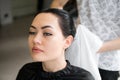 Hair stylist drying woman hair with towel in salon Royalty Free Stock Photo