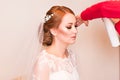 Hair stylist makes the bride on the wedding day Royalty Free Stock Photo