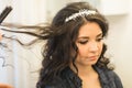Hair stylist makes the bride on the wedding day Royalty Free Stock Photo