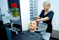 Hair stylist washing hair