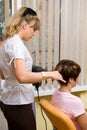 Hair stylist working on a clie Royalty Free Stock Photo